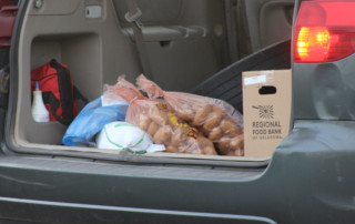 Food sits in the back of a vehicle during a Regional Food Bank food distribution in November 2021.