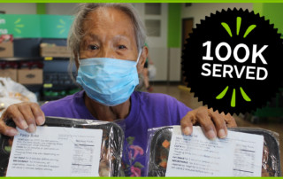 A woman holds Senior Servings Program meals.