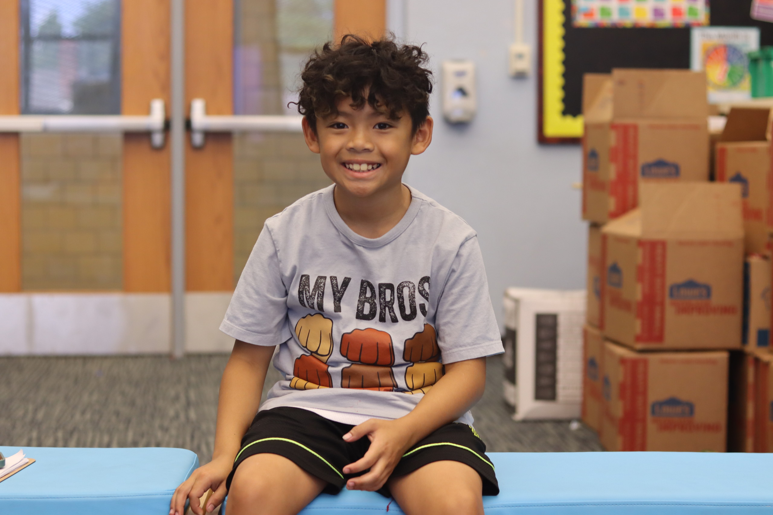 A participant in the Regional Food Bank's Summer Feeding Program poses for a photo