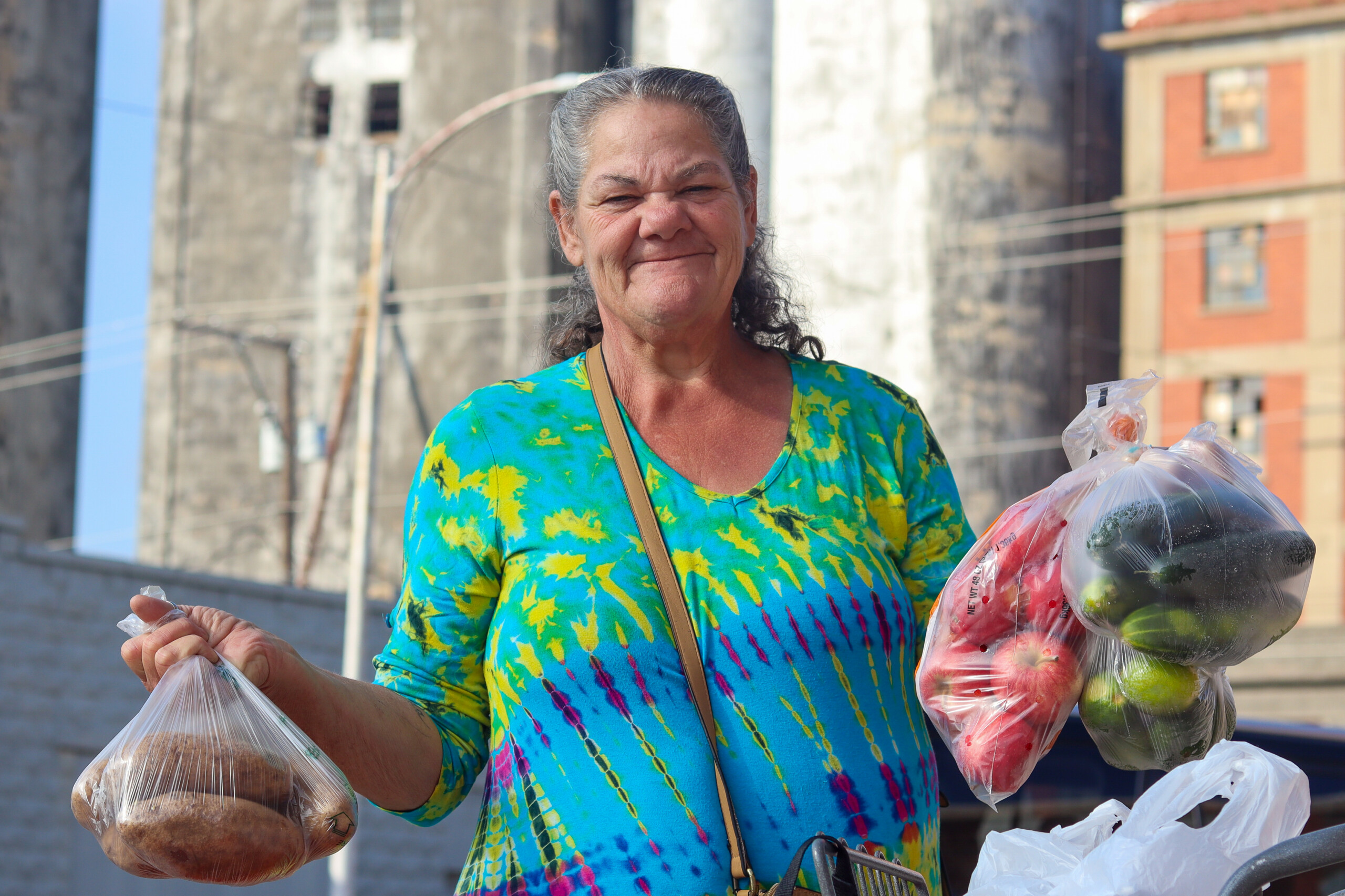 Senior Neighbor Holding Produce Bags